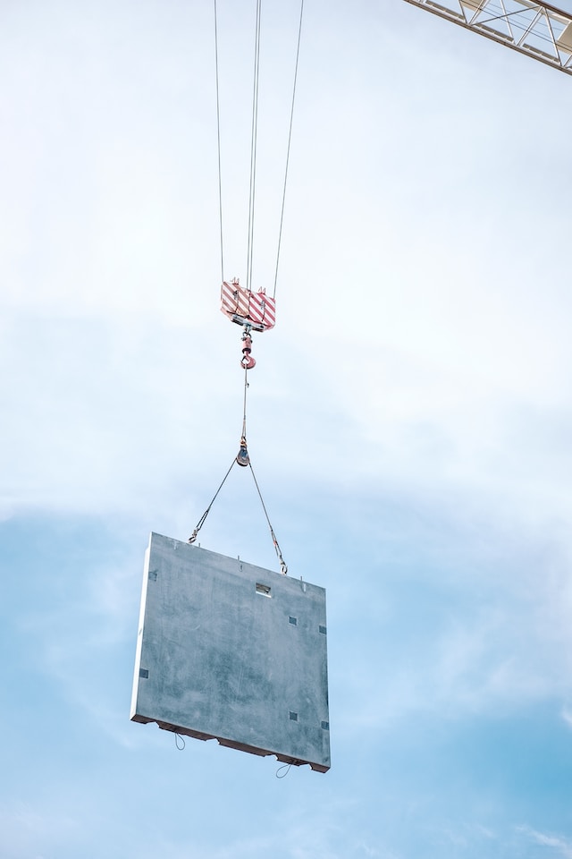 overhead crane lifting concrete block