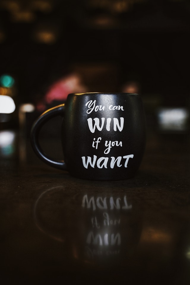 "you can win if you want" text on mug
